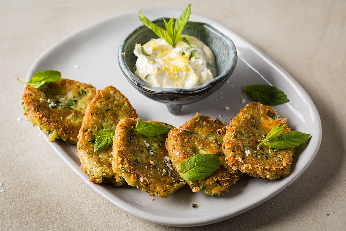 Spicy Pea and Goat's Cheese Fritters with Minted Crème Fraîche - Mains Recipe